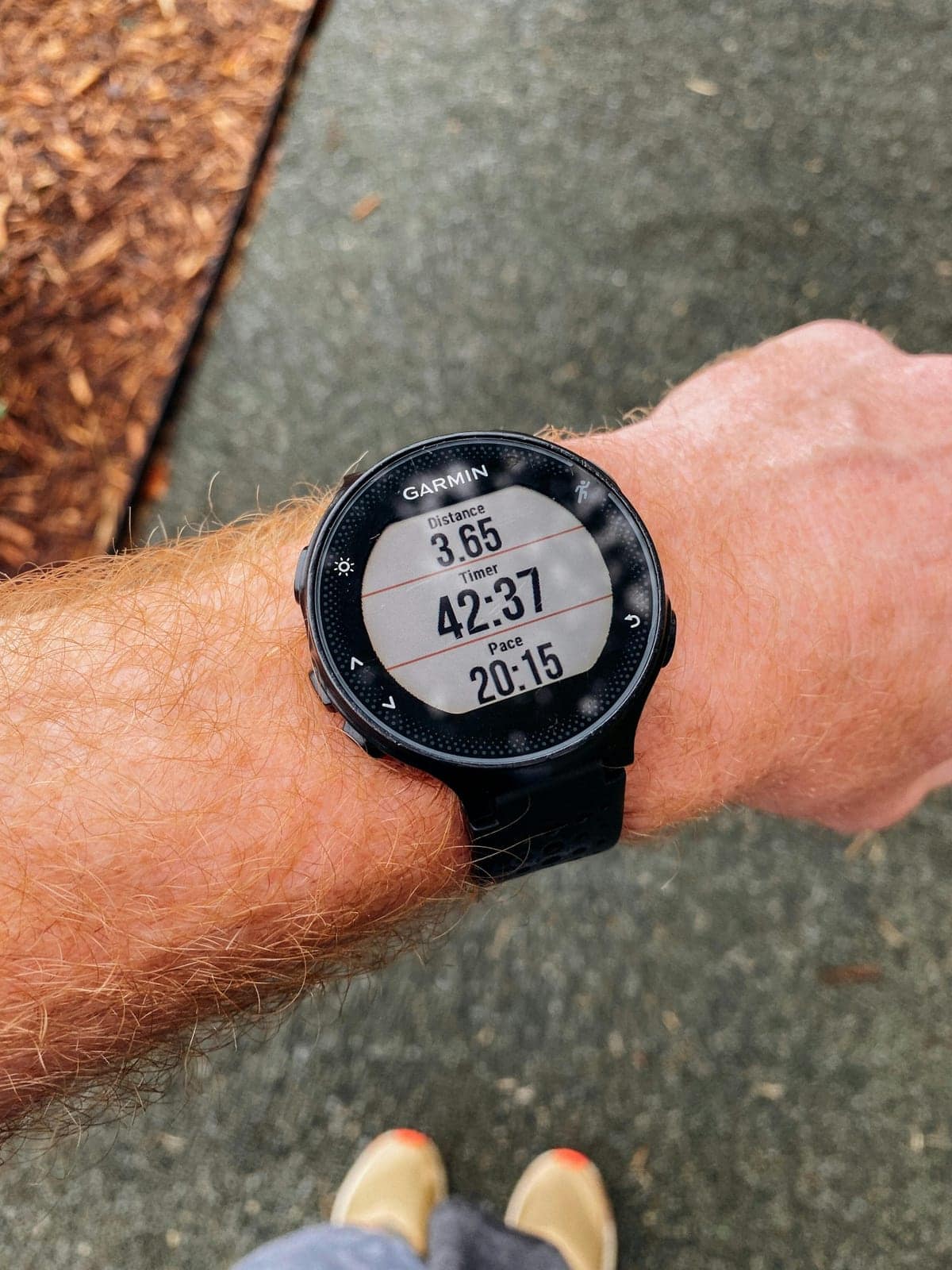 Garmin running watch showing distance, timer and pace data