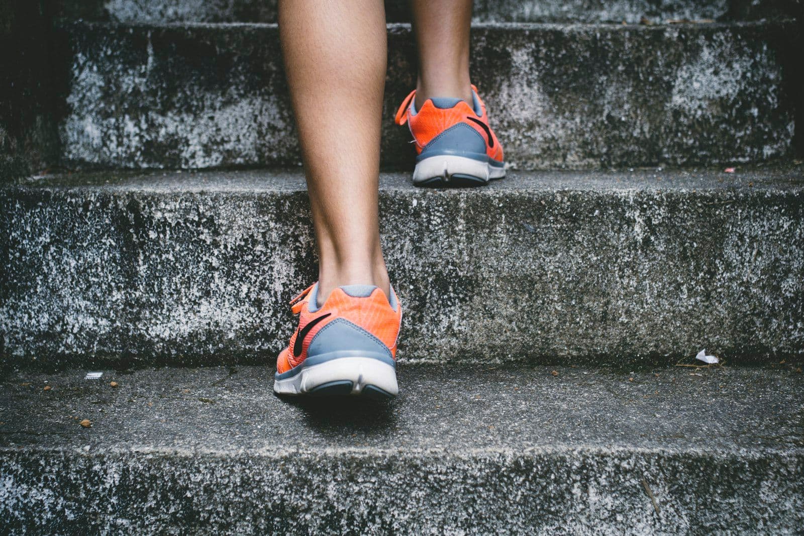 legs wearing running shows walking upstairs